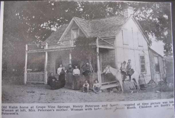 with 4 horses pulling. He loaded and unloaded these by hand. The caption on the bottom of this photo reads: Old Kuhn home at Grape Vine Springs.
