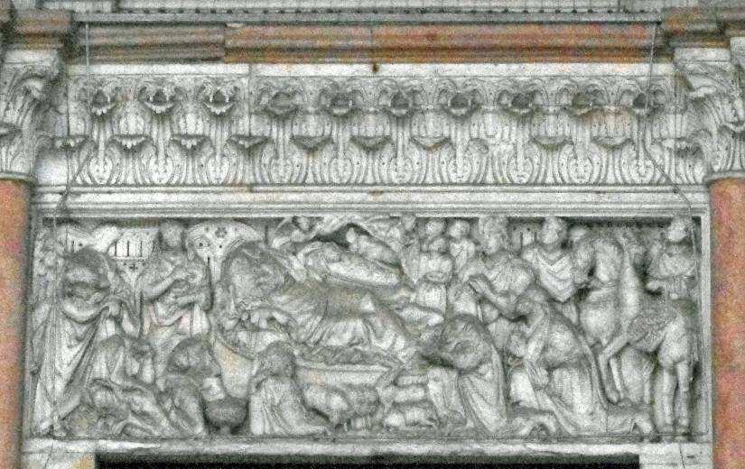 The tympanum of the left doorway shows the descent of Christ from the Cross. It is a scene that is crowded with figures and full of pathos.