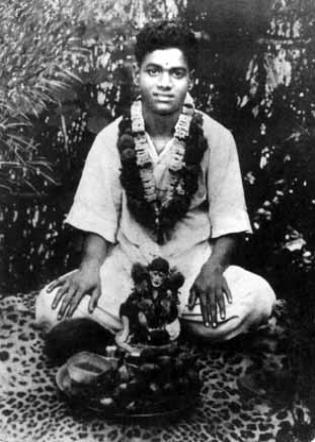 11a An early photograph of Sathya Sai Baba in a pose and with a walking-cane reminiscent of Sai Baba of Shirdi. Fig.11b A typical painting of Sai Baba of Shirdi (d.