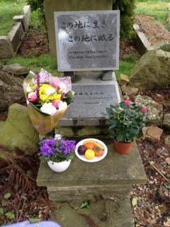 Junichi pays respect to Masao s resting