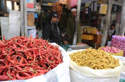 A market stall with chillies and turmeric for