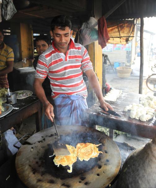 Eggs cooking in a market stall Rice