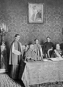 Seite 12 von 21 Cardinal Secretary Merry del Val and Monsignore Eugenio Pacelli at the signing cerimony of the Serbian concordat underneath the picture of Pius X Pius X reversed the accommodating