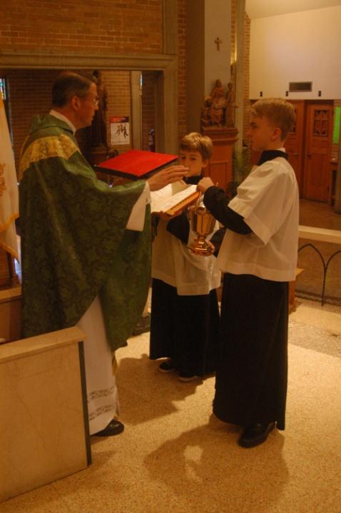 The altar boys join with the People in the responses and other parts assigned to them.