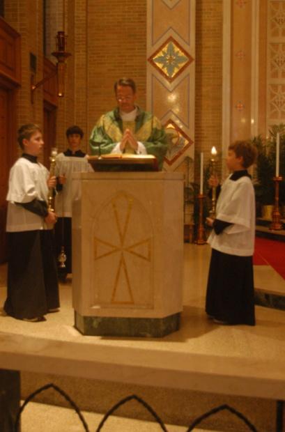 The thurifer then goes over and stands to the left of the candle bearers. During the Gospel the thurifer hands the censer to the Priest at the appropriate time.