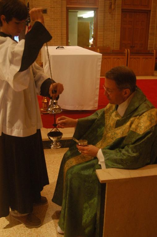 He returns the censer to its place when the Gospel is finished, returns to his seat and listens attentively to the Homily.