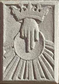This symbol depicts God as King of the Universe. The hand with the crown represents God the Father s blessing and protection.