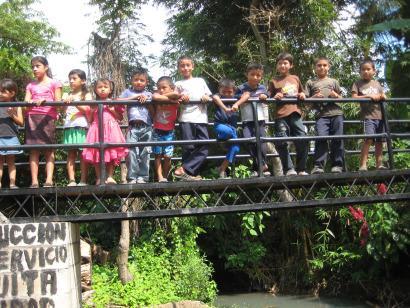 Children on the bridge in Tapahuasuya, one of three new bridges enabling