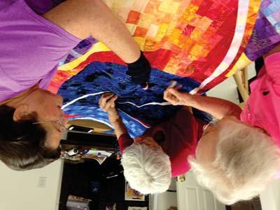 Laura Palmer has hosted e quilt group over several weeks of visioning, piecing, constructing, and quilting.