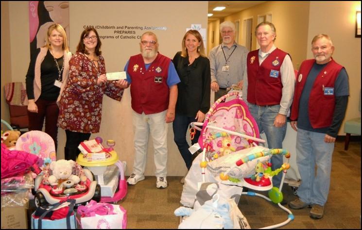 gather items collected from our third and final Baby Shower for the year in support of Catholic Charities C.A.P.A. Program.