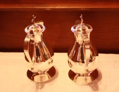 Cruet A glass or silver container for wine and water used in the Eucharist. On some cruets the letters V and A are engraved on the handle.