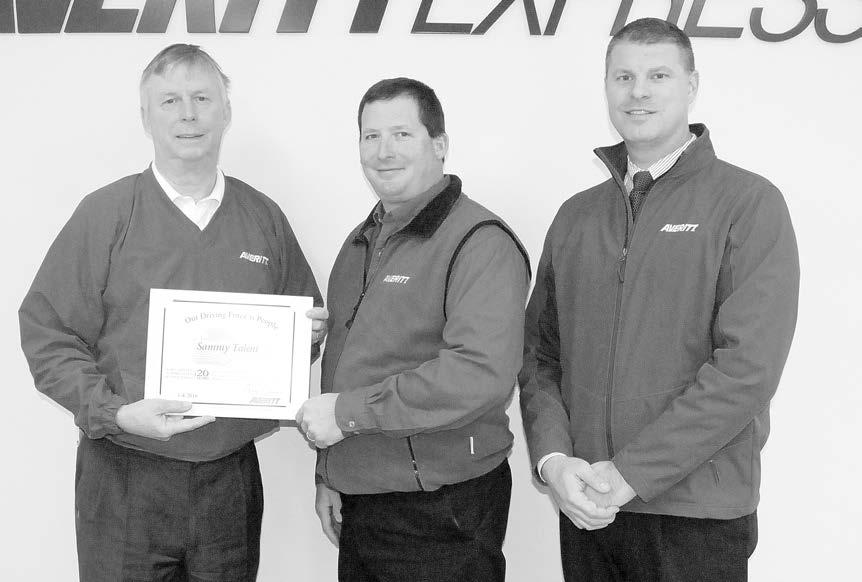 Sammy Talent, center, is welcomed to the Averitt Over 20 Team by Cookeville service center director Pete Ziegler right, and Averitt Chairman and CEO Gary Sasser.