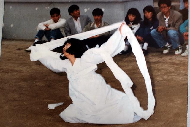 Figure 5. At Seoul National University, 1986, Dani is dancing a Salpuri (resolving grievances) dance for the dead who died during pro-democracy protests.