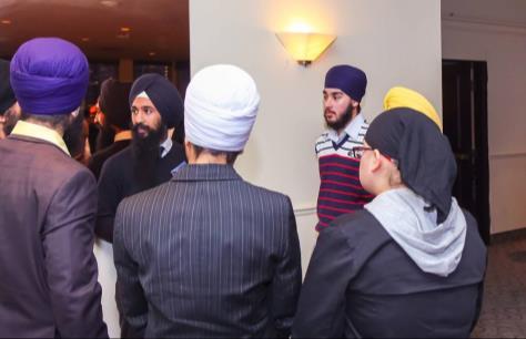 getting a turban tied and in the process provided a background on the Sikh faith and significance of the turban.