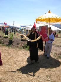 Procession at Ewam's 2005 Festival of Peace in Arlee, MT. The parasol is shading a photo of His Holiness the Dalai Lama.