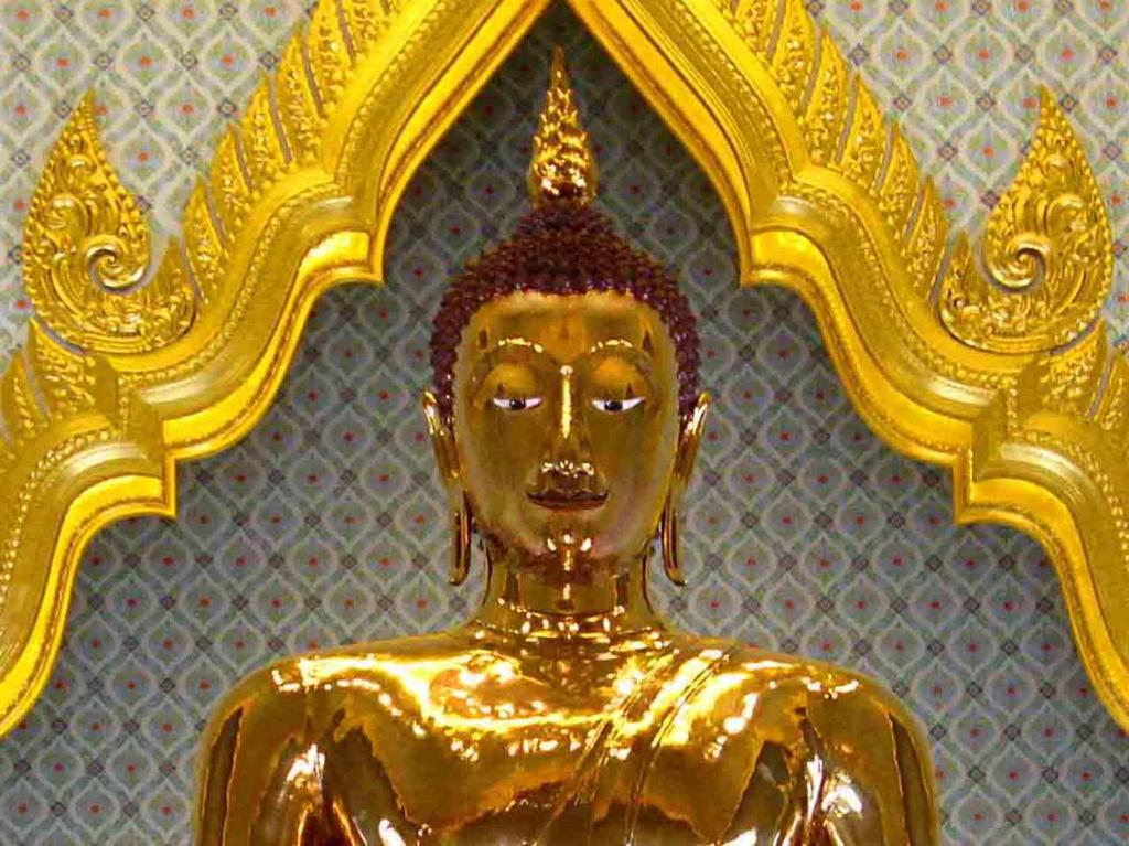 Photo 20. Head and shoulders of the Golden Buddha (with some glare removed from the face). The Golden Buddha is the largest solid gold statue in the world! It is 9 meters high and weighs about 5.