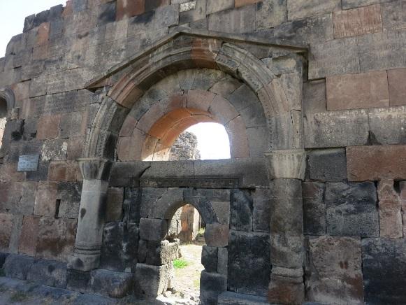 The relieving arch was replaced with a semicircular tympanum in the 7th c. Armenian architecture.