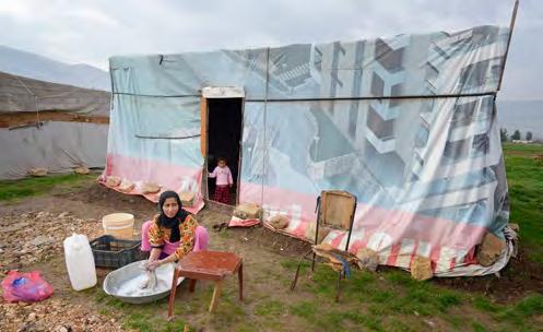 GLOBAL PARTNERS Paul Jeffries, ACT Alliance Zahida, a refugee from Syria, does laundry in front of her family s shelter in the village of Jeb Jennine in Lebanon.