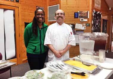 Chef Hank Levitt and client Eneitra Beattie of the Common Table program, a social enterprise activity designed to train refugees and others in need of job