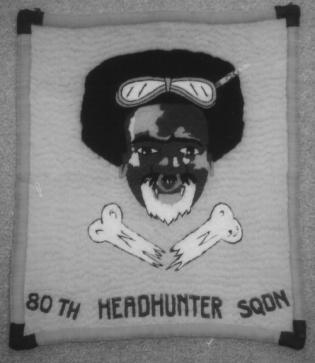 I have a wall hanging I made for him of the original Headhunter insignia and also a 5 th Air Force pillow that I m wondering if you would like to have for your archives.