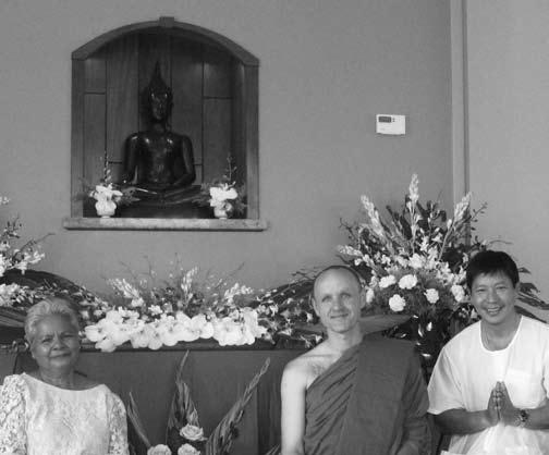 The 700 year old Buddha image watches over the central meeting room of the Bhikkhu Commons. Seated below are Ploern Petchkue, Ajahn Sudanto and Krit Leekamjorn at the opening ceremony.