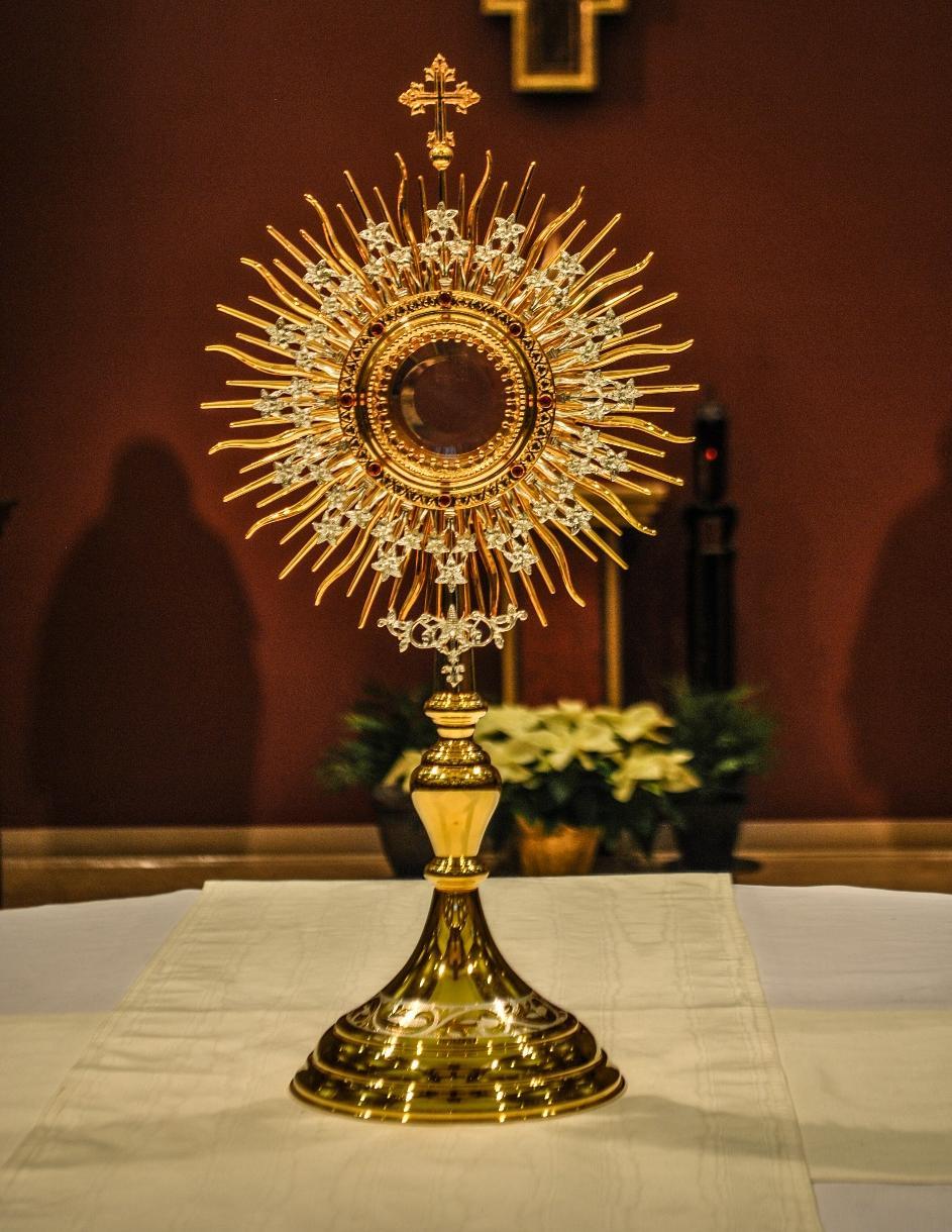 A Monstrance is a vessel that holds a consecrated Communion Host for purposes of Exposition (showing) and Adoration (prayer) of the Blessed Sacrament.