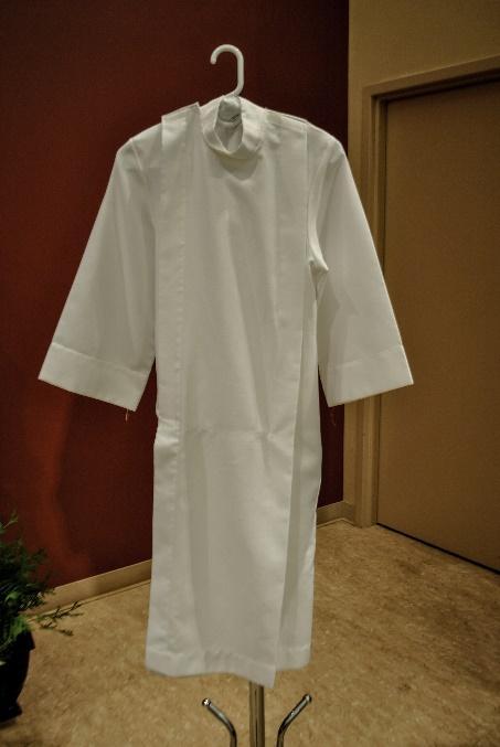 Those who serve the liturgy (bishops, priests, deacons, altar servers, and masters of ceremony) all wear a white Alb, symbolizing the