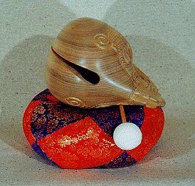 The mokugyo is struck with a wooden mallet that has a leather covered spherical head on its end.