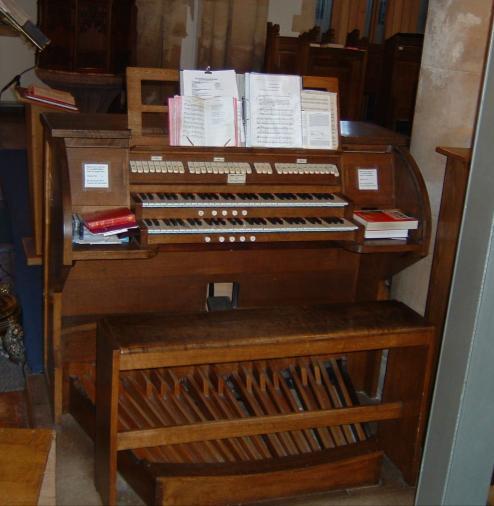Looking at the modern console of the organ, above the two rows of keyboards you will see a row of cream organ stops.