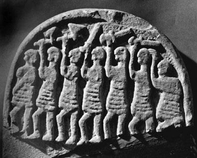 Stone carving from Lindisfarne, England (ninth century c.e.). The procession of warriors is reminiscent of forces gathering for the final battle of Ragnarök.