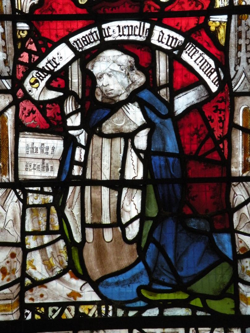 The window depicts scenes from the life and miracles of St Martin, Bishop of Tours, clustered around a large standing figure of the saint, in full vestments.