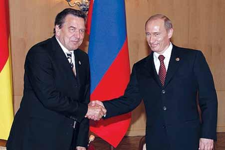 Kremlin.ru Former German Chancellor Gerhard Schröder with President Putin in Moscow on May 9, 2005.