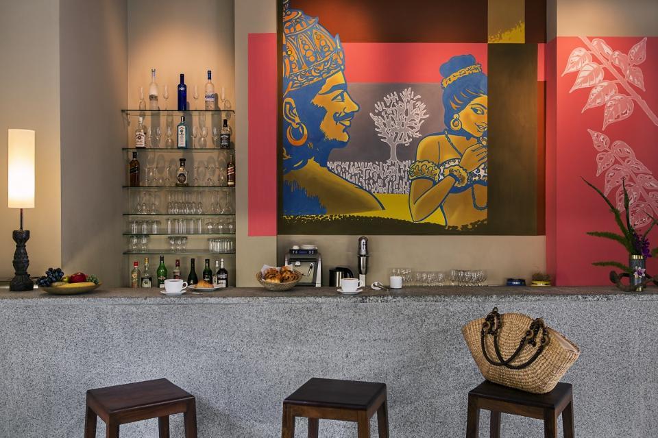 Lounge and bar at Villa Shanti, which includes a mural by a local artist.