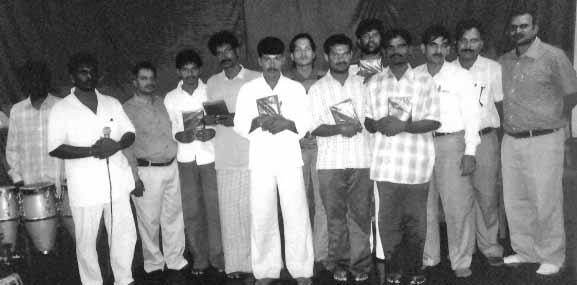 (Above) 2 Oriya, 5 Kannada prisoners, who made decisions for Jesus, received free Bibles from KSM. OM and KSM staff with them.