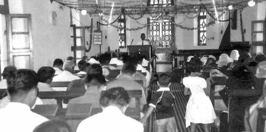 (Top) Rev. B. D. Immanuel, preaching at Brethren Assemblies at Bluff, Malavalli. (Right) 5 brothers who made decision for the Lord are being baptized by Brethren Assembly elders, including Dr.