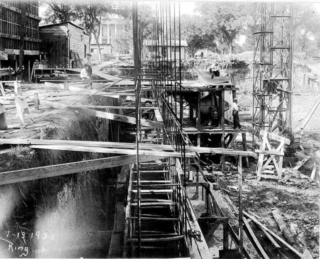 Fig 7: Preparing to pour the foundation of the building. Notice the deep trenches needed to accomplish this. Fig 8: A section of pillar arrives at the job site Via horse drawn carriage.