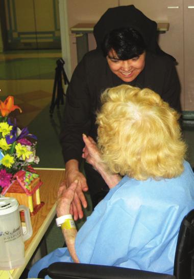 Our Life in Pictures Sister M. Angelita delivers flowers to a patient at St.