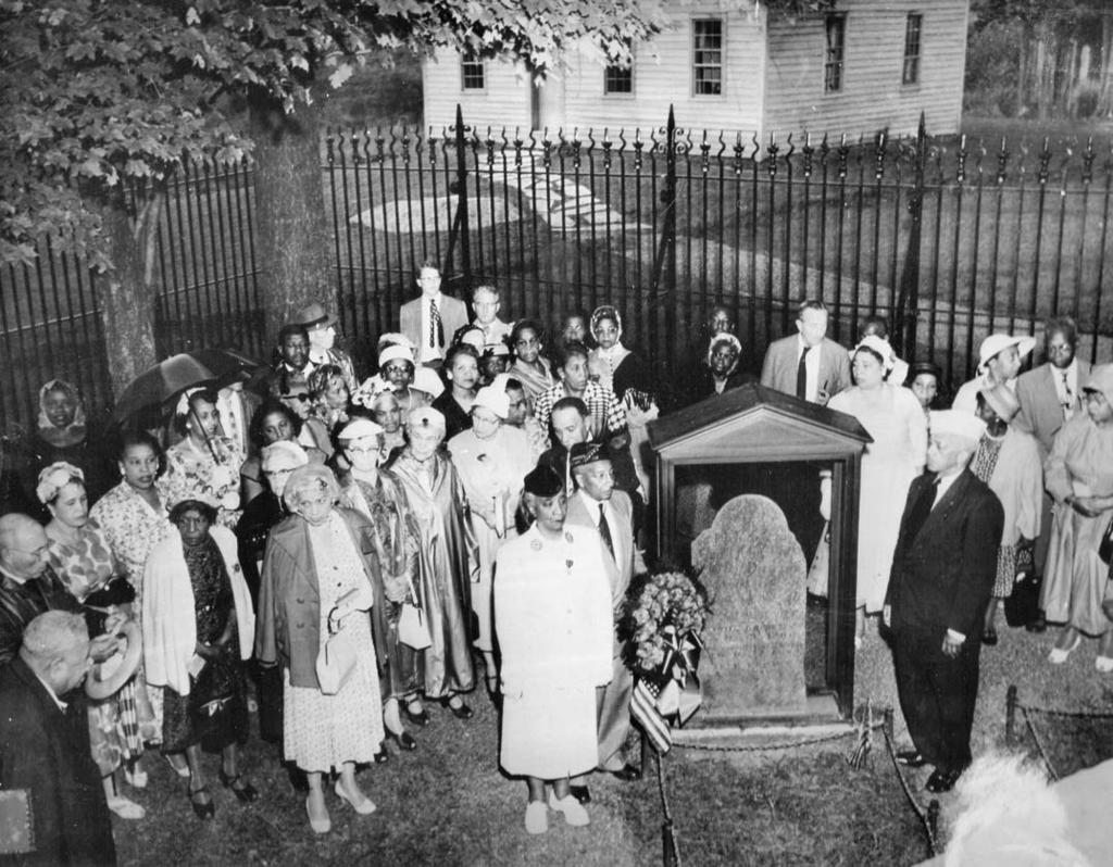 COURTESY FREDERICK DOUGLASS CHAPTER, JOHN BROWN MEMORIAL ASSOCIATION Members of the John Brown Memorial Association are gathered in July 1959 at the Brown gravesite to mark the 100th anniversary of
