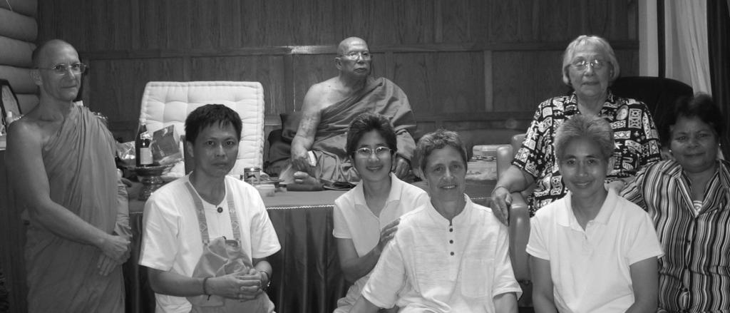 This photo was taken in Phuket, southern Thailand. Luang Boo Soo-Pah is sitting in the back. Ajahn Pasanno s mother, Rhoda Perry, is sitting in the chair.