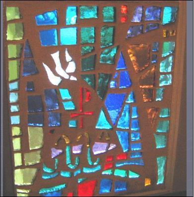 THE FOURTH WINDOW begins with a symbol of Jesus baptism which combines a fish in water, a Chi Rho (the monogram for Jesus Christ) and a dove which lighted on Jesus shoulder following His baptism