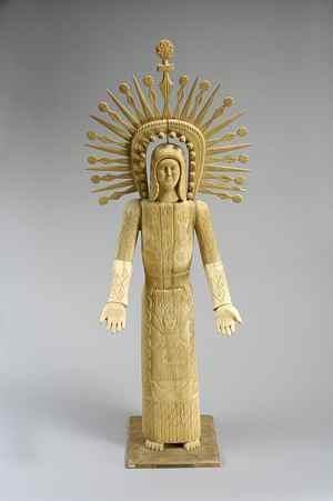 statue of Jesus Christ, a saint, angle or the Virgin carved from cottonwood root, covered with gesso and painted.