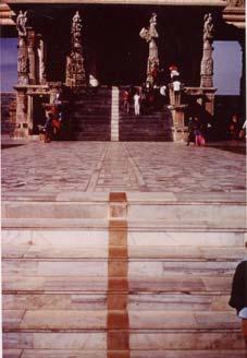 This huge stone Nandi near Mysore, India, has the sign of Shiva across his nose: three horizontal white bars. Nandi is Sanskrit for joy. Nandi is Shiva's vehicle: joy (vibrant energy).
