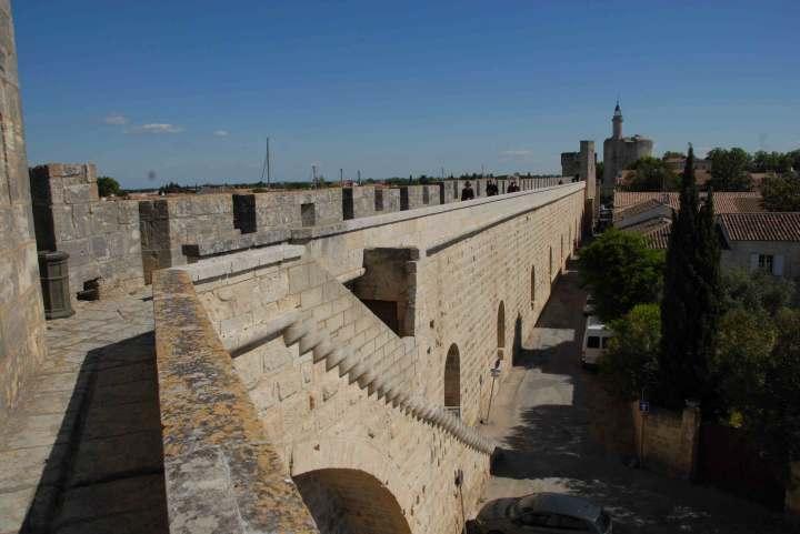 Walls of the city of Aigues-Mortes, with the Round Tower in the distance In the course of years her fa ther was re leased, her lover was re leased, her brother died a mar tyr s death, and most of her