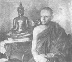 The English Sangha Trust (1955-1957) 47 Bhikkhu Pannavaddho (formerly Peter Morgan) sits beside a Buddha statue at the house in Grosvenor Square, Sale where he lives.