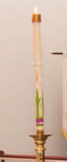 PasChaL CanDLe: A large candle about three feet high in a stand.