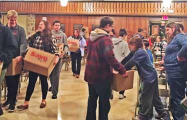 Patrick s in the parish hall to prepare food baskets for needy fami