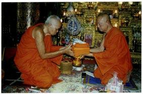 Buddhist Archive Luang Prabang EAP A 196 Phra Khamchanh offers yellow robe to Sathou On Ta at Vat Saen Probably a Kong Hot Ceremony for Sathou On Ta, Abbot of Vat Manorom, 1990s