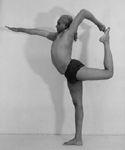 20. Urdhva Dhanurasana (from two bolsters) 21. Dwi Pada Viparita Dandasana (supported on chair; feet on floor, with bent elbows holding the front legs of the chair; legs bent or straight) 22.