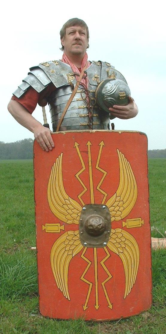 Paint your shield using the design on this legionaries shield. Use a yogurt pot for the shield boss, painted silver.