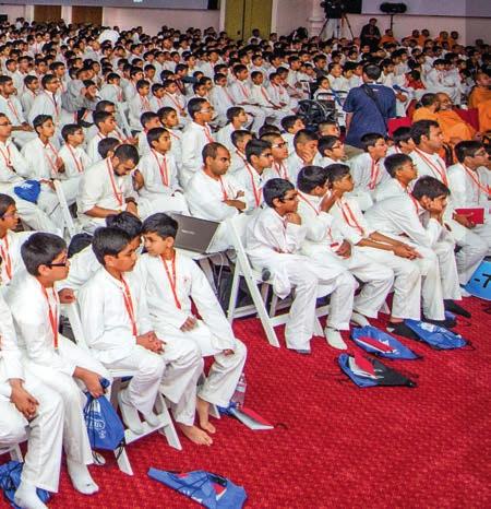 Children enjoy the presentations Over 3,000 balaks and balikas attended the convention Balaks perform on the sound stage watched as the main character, Akshar, struggled with his niyam-dharma and